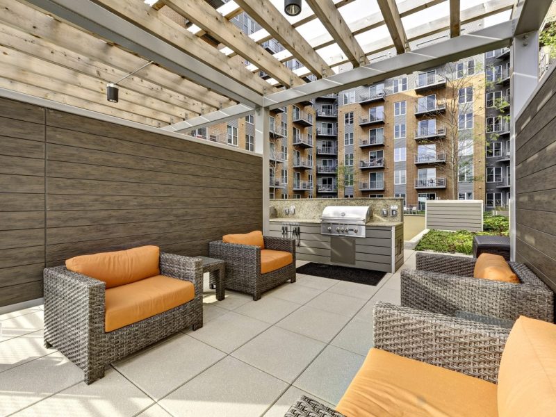 This image shows the outdoor lounge and grilling station area.
