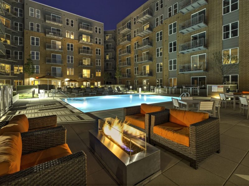 This image shows the resort-style outdoor swimming pool that overlooks the tall TGM NorthShore establishment and bringing the luxurious water experience with light effects during night swimming. The pool area is also accessible to the fire pits that were ideal for fun moments with family and friends.